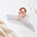 Detail view of 13cm UV plated hair claw clip with an iridescent gradient finish - UV Electroplated Gradient Orange