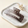 Close-up of a brown gradient square hair claw clip with quilted diamond pattern texture. - Glossy Gradient Coffee