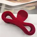 Detailed macro view of burgundy flocked hair claw clip with elegant velvet texture - Bowknot Shape / Burgundy
