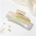 Large iridescent gradient hair claw clip featuring a rectangular design and a gold spring mechanism - UV Electroplated Gradient Champagne