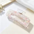 Close-up view of a premium acrylic floral hair claw clip with elegant pink flakes - Square Patchwork Style / Floral Pink