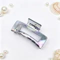 Close-up view showing the iridescent electroplated finish of this square hair claw clip - AB Rainbow Gunmetal