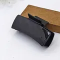 Close-up detail of the glossy and smooth surface on a 11cm black square hair claw clip - Glossy Style / 10.5cm Size