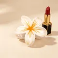 Elegant white and orange Plumeria flower hair claw clip with a glossy UV finish for updos - UV Orange Center