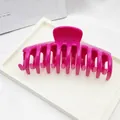 Close-up of a large fuchsia fashional claw hair clip with a smooth glossy finish - Rose Red