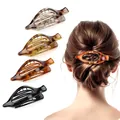 Leopard print duckbill hair clips and shark claw clips shown in varied colors and on model - 4 Pieces/Pack / Pointed Duck Clip - 4 Colors