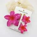 Close-up of three vibrant pink eggflower hair clips on a white fashion jewelry display card. - 3-Piece Set (1 Large 2 Small) / Purple And Red