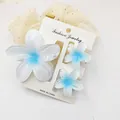 Close-up detail of blue gradient frangipani flower hair claw clip set for summer vacation - 3-Piece Set (1 Large 2 Small) / White and Blue