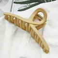 Detailed view of a large beige matte hair claw clip with a stylish twisted ribbon design. - Streamer Style (15) / 11cm / Khaki