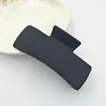 Detailed top view of a large matte black square hair claw clip for women's styling - Black