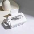 Close-up macro view of a large minimalist matte white square hair claw clip detail - 5cm Square Block / Matte Pure White