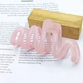 Close-up of a pink jelly-colored wavy hair claw clip with a glossy finish - Wave Shape (Transparent Jelly Wave) / Jelly Pink