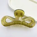 Close-up of a jelly olive green hair claw clip showing its unique translucent texture - Jelly Green