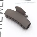 Close-up of matte dark grey rectangular hair claw clip for French style updos - Matte Dark Coffee