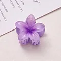 Close-up of a 4cm purple frangipani flower hair claw clip with semi-clear petals. - Purple & Purple