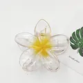 Close-up of translucent plumeria flower hair claw clip with yellow center - Frangipani Style / 8cm / Transparent Yellow