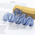Macro detail of large wave-shaped hair claw clip in a translucent jelly blue finish - Wave Shape (Transparent Jelly Wave) / Sapphire Blue