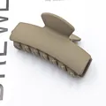 Detailed view of a matte khaki rectangular French hair claw clip for women's hairstyling - Matte Light Coffee