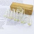 Close-up detail of a large wavy jelly hair claw clip placed on a literary text background - Wave Shape (Transparent Jelly Wave) / Champagne