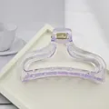 Close-up view of a minimalist purple translucent hair claw clip on a white display tray - Light Purple