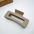 Detailed view of a matte khaki square hair claw clip featuring a sturdy spring mechanism. - 10.5cm Square Style / Matte Light Coffee