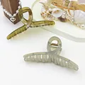 Close-up of translucent jelly hair claw clips in olive green and light grey. - Pack of 2 / Green And Gray