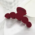Close-up of large red velvet hair claw clip with an elegant flocked texture for winter - 10 Five Rings Style / Burgundy