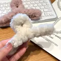 Detailed view of soft plush hair claw clip showing fluffy texture and large size - 13cm / Off White