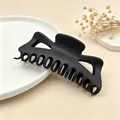 Detailed view of a large black matte finish hair claw clip for thick hair styling accessory - Dark Coffee