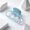 Close-up of iridescent UV-plated hair claw clip with smooth gradient finish - UV Electroplated Gradient Blue