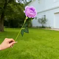 Realistic single purple artificial rose held in hand, decorative silk flower for home decor - Purple