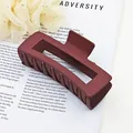 Detailed view of large matte burgundy rectangular hair claw clip for thick hair styling - Burgundy