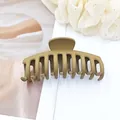 Close-up of a matte khaki large French hair claw clip on white background - Medium Coffee