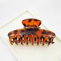 Macro view of large leopard print hair claw clip with glossy tortoiseshell finish - Flat Spine Style / 9cm / Red Leopard