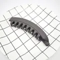 Side view of a large matte grey banana hair clip on a minimalist grid background - Matte Dark Coffee