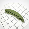 Detail shot of a matte olive green banana hair clip for thick hair on a grid plate - Matte Dark Green