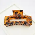 Detailed close-up of large leopard print hair claw clip with geometric diamond texture - Rhombus Square Style / 8.5cm / Red Leopard
