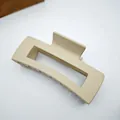 Close-up of a large matte beige square hair claw clip on a clean white background. - 10.5cm Square Style / Matte Beige Coffee