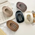 Set of five large matte frosted hair claw clips in various neutral earth tones detail view - 5 Pieces/Pack / Oval Duck Clip - 5 Colors