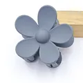 Close-up of a matte gray five-petal flower hair claw clip for women's hairstyling - Gray