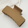 Detailed view of a matte square hair claw clip in camel color with fine texture - Medium Brown