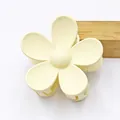 Matte pale yellow flower hair claw clip with five petals for elegant hairstyling. - Off White