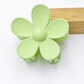 Close-up of matte pale green five-petal flower hair claw clip with smooth texture - Light Green