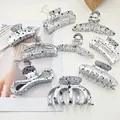 Collection of silver metallic hair claw clips featuring artistic black splatter pattern designs - Gold Speckled Style / 9 Pieces/Pack / Gold with Black Dots