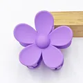 Close-up of a matte purple five-petal flower hair claw clip on a white background. - Purple