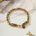Detailed view of retro gold-finish dragon head bracelet with punk totem pattern details. - 21cm / 5mm Width / Gold