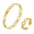 Detailed view of the gold hollow heart link magnetic bracelet and adjustable ring set - Bracelet And Open Ring / Gold (LKAX-SL+JZ)