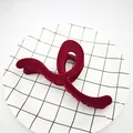 Macro view of a luxury wine red velvet flocked hair claw clip on a modern grid plate - Curved Ribbon Style / 13cm / Burgundy