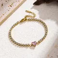 Close-up of gold stainless steel tennis bracelet with pink heart zircon - Pink Heart Style