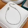 Minimalist stainless steel sparkle chain necklace shown on a white luxury jewelry box - Silver Bracelet (5515) / Silver